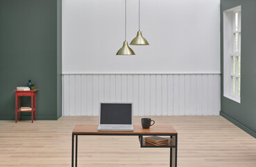Close up wooden desk and computer style, lamp and white wall background interior room design.
