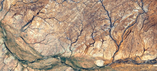 abstract landscape of the deserts of Africa from the air emulating the shapes and colors of the forests in Autumn