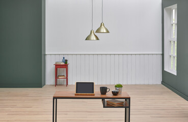 Close up wooden desk and computer style, lamp and white wall background interior room design.