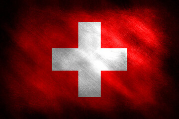 Fototapeta premium The flag of Switzerland on a blackboard background