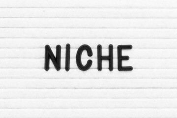 Black color letter in word niche on white felt board background