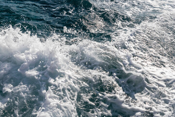 Blue water surface with waves at sea
