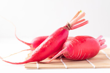 Red daikon radish on white background, Organic vegetables from Asian local market