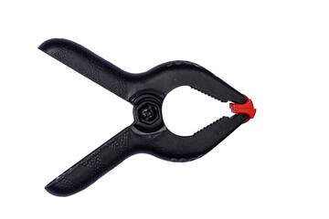 Obraz premium Black plastic clamp, isolated on a white background.