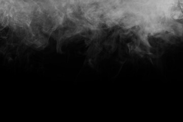 Abstract smoke texture over black. Fog in the darkness.