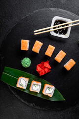 traditional japanese sushi dish, rolls. Sushi on a dark background