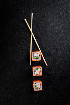 traditional japanese sushi dish, rolls. Sushi on a dark background