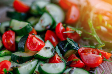 Vitamin salad from fresh natural vegetables. Cucumbers with tomatoes and flax seeds. Healthy vegetarian food. Background