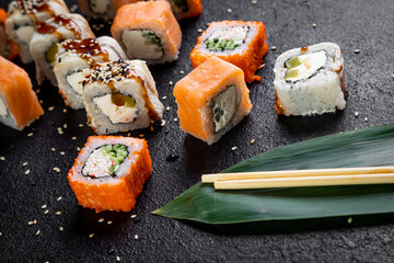 traditional japanese sushi dish, rolls. Sushi on a dark background