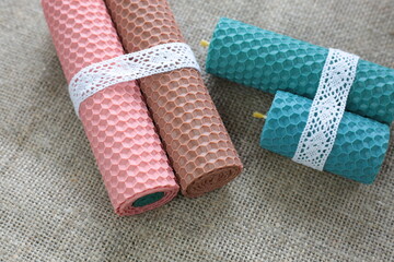 Beeswax candles  on rustic background.