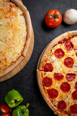 pizza with ingredients on a dark background
