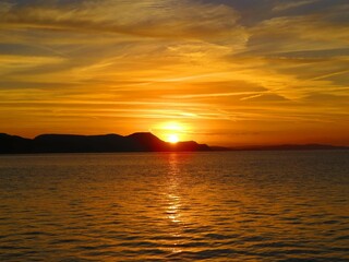 beautiful bright colourful sunrise over the sea and cliffs	