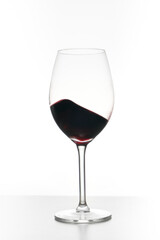 Glass of red wine isolated on white