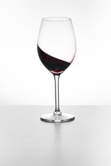Glass of red wine isolated on white