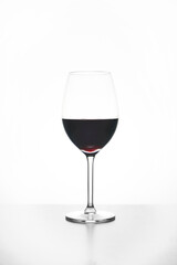 Glass of red wine isolated on white