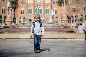 Fototapeta premium Cute little child tourist, admiring Barcelona city, family travel with kids