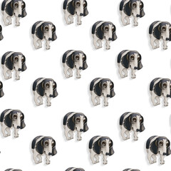 Seamless pattern with a cute black and white spotted dog on a white background. - 489912717