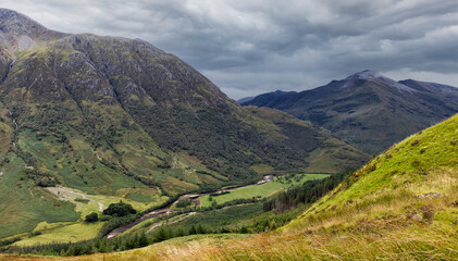 Naklejka premium Looking Up Glen Nevis from the West Highland Way with the Slopes of Ben Nevis and Sgùrr a' Mhàim in the Centre.