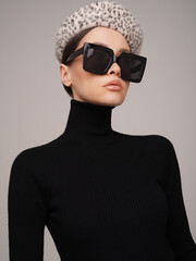 Beautiful young lady in a black turtleneck - 489913916
