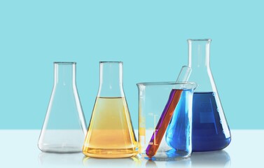 Modern laboratory equipment. Laboratory glass equipment with water ingredients. Research and development cosmetics concept