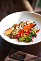 Steam salmon and vegetables, Paleo, keto, fodmap, dash diet. Mediterranean food with steamed fish. Oven baked asian dish with teriyaki. Healthy concept