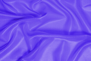 Blue shiny pearl fabric as a background.