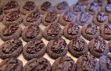 A cookie is a baked or cooked snack or dessert that is typically small, flat, and sweet. 