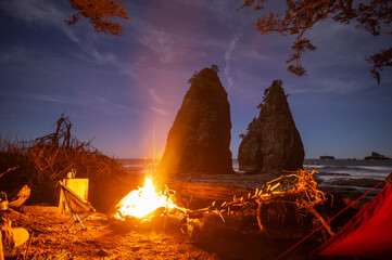 Campfire glowing in campsite on the Olympic National Park Coast