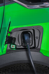 Electric vehicle - Mobility - E-Car charging on charge station. Eco-friendly sustainable energy....