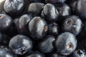 Assortment of red fruits, strawberries, blueberries and raspberries, close up