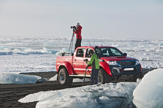 photographers taking pictures from a customised 4x4 pick up truck