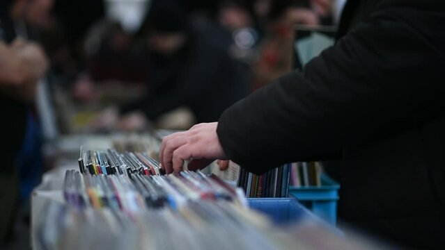 Man hands browsing vinyl album in a record store
