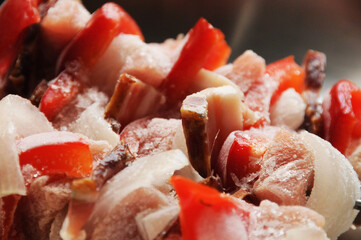 Metal stainless sticks with meat and vegetables ready to grill