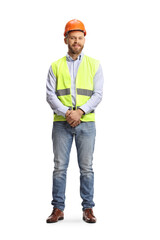Full length portrait of a young male site engineer wearing safety equipment