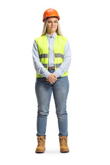 Full length portrait of a young female engineer wearing safety vest and hardhat