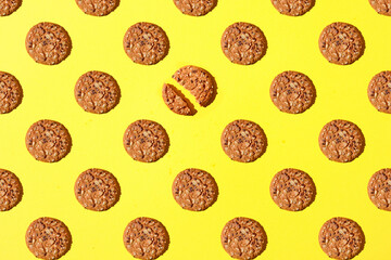 Pattern made of Oatmeal cookies with seeds. Oatmeal cookies with seeds. Repeating Oatmeal cookies pattern. Flat lay style...