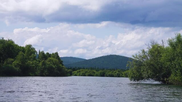 Middle Siberia, Krasnoyarsk Territory. Hilly (coniform hill) river bank, pour. Taiga mixed forests