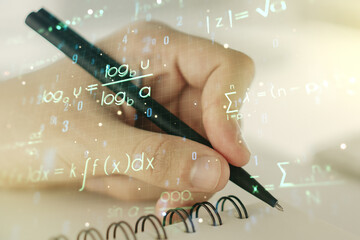 Double exposure of creative scientific formula concept with man hand writing in notebook on background, research and development concept