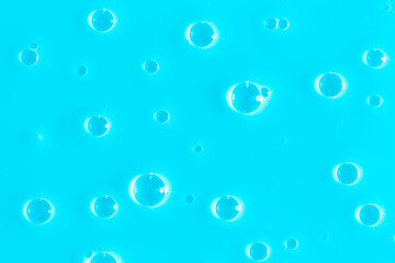 Bubble light blue background texture. Berry gel to cleanse the skin of the face and body. Spa treatments, skin care. Bath foam, detergent. Slime blue