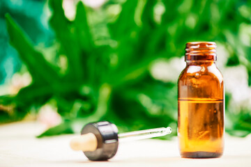 bottle of cannabidiol oil for the natural treatment of muscular pains