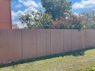 white fence and blue sky