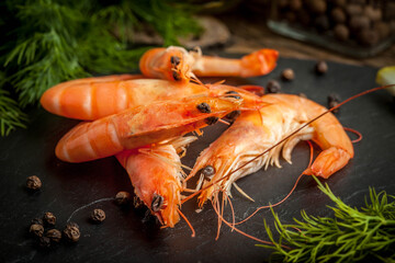 Shrimps for dinner on stone plate.