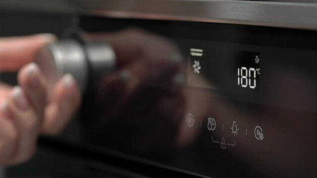 Setting cooking modes and oven temperature. Cooking, baking. LCD display.