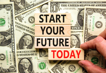 Start your future today symbol. Concept words Start your future today on blocks. Businessman hand. Beautiful background from dollar bills. Start your future today business concept. Copy space.
