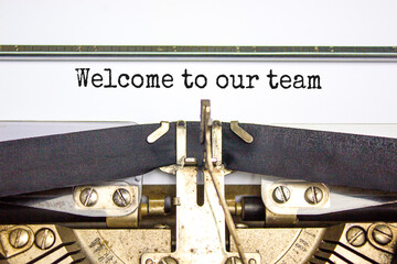 Welcome to our team symbol. Concept words Welcome to our team typed on retro typewriter. Beautiful white background. Business, motivational and welcome to our team concept.