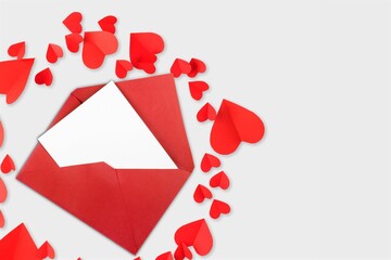 Red paper envelope with empty white card and heart, valentines day concept.