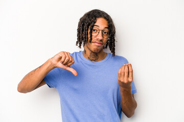Young African American man isolated on white background showing that she has no money.