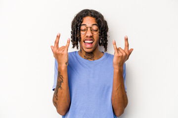 Young African American man isolated on white background showing a horns gesture as a revolution concept.