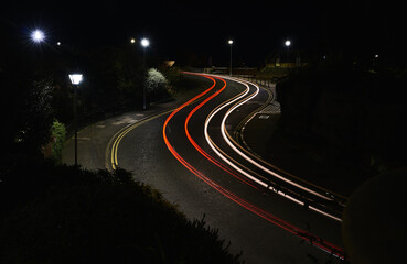 Fototapeta na wymiar Red and white light trails on an s bend