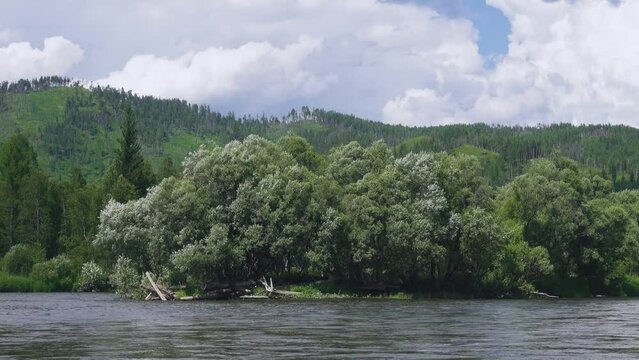Middle Siberia, Krasnoyarsk Territory. Hilly (coniform hill) river bank, pour. Taiga mixed forests